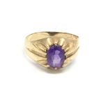 A gents 9carat gold ring inset with an amethyst st