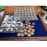 A 12 draw coin cabinet with a large collection of