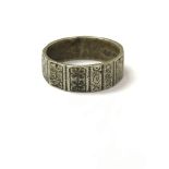 A sterling silver band ring with geometric pattern