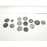 A collection of Ancient Roman coins including a Sc