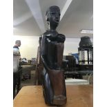 A large carved heavy African figure of female