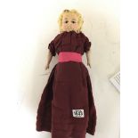 A Victorian poured wax head doll with pained wood