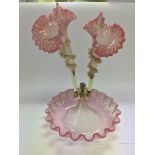 A pink glass epergne, centre branch missing.
