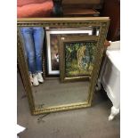 A rectangular gilt framed modern mirror measuring