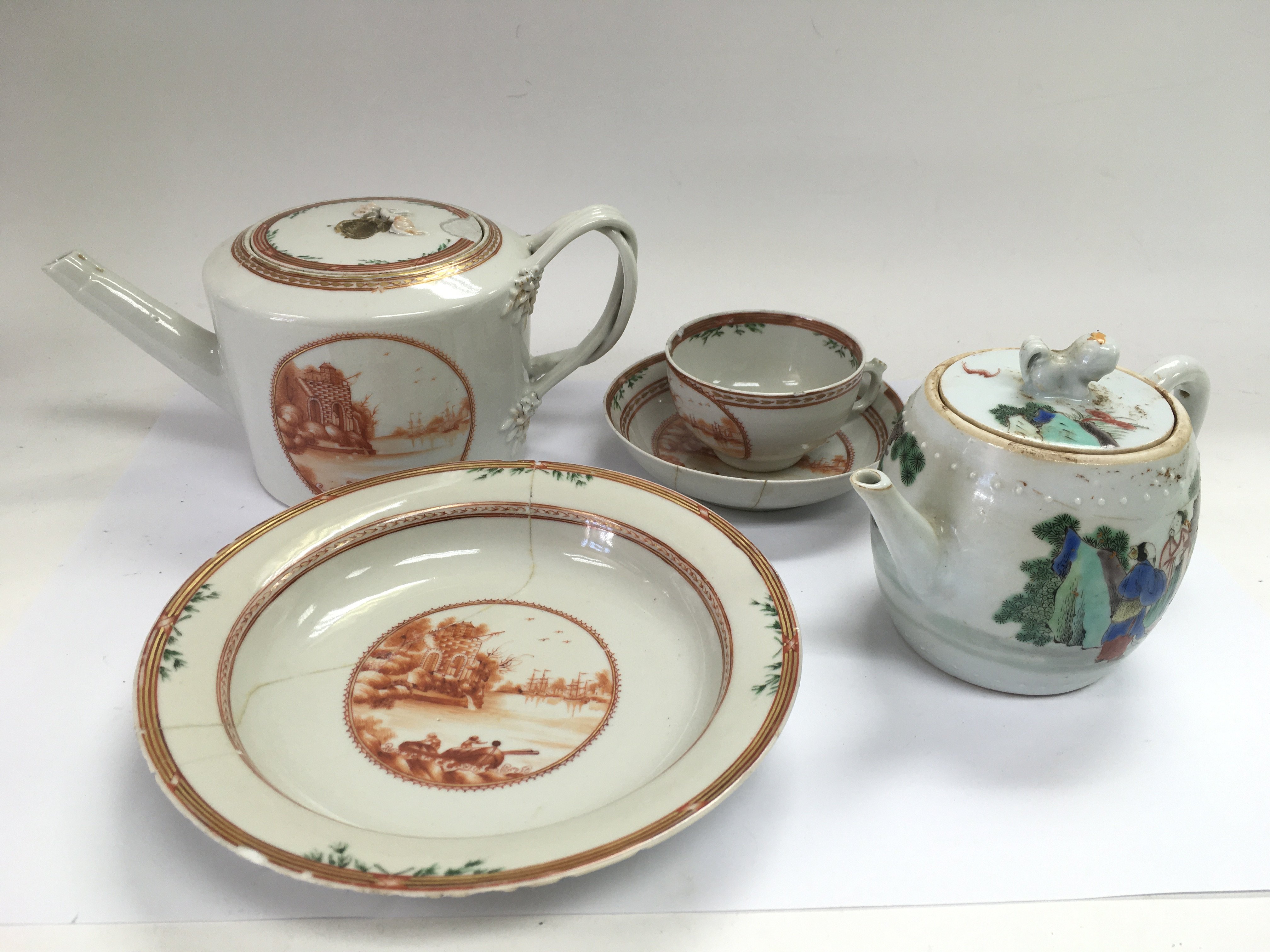 An Oriental teapot with matching cup, saucer and b