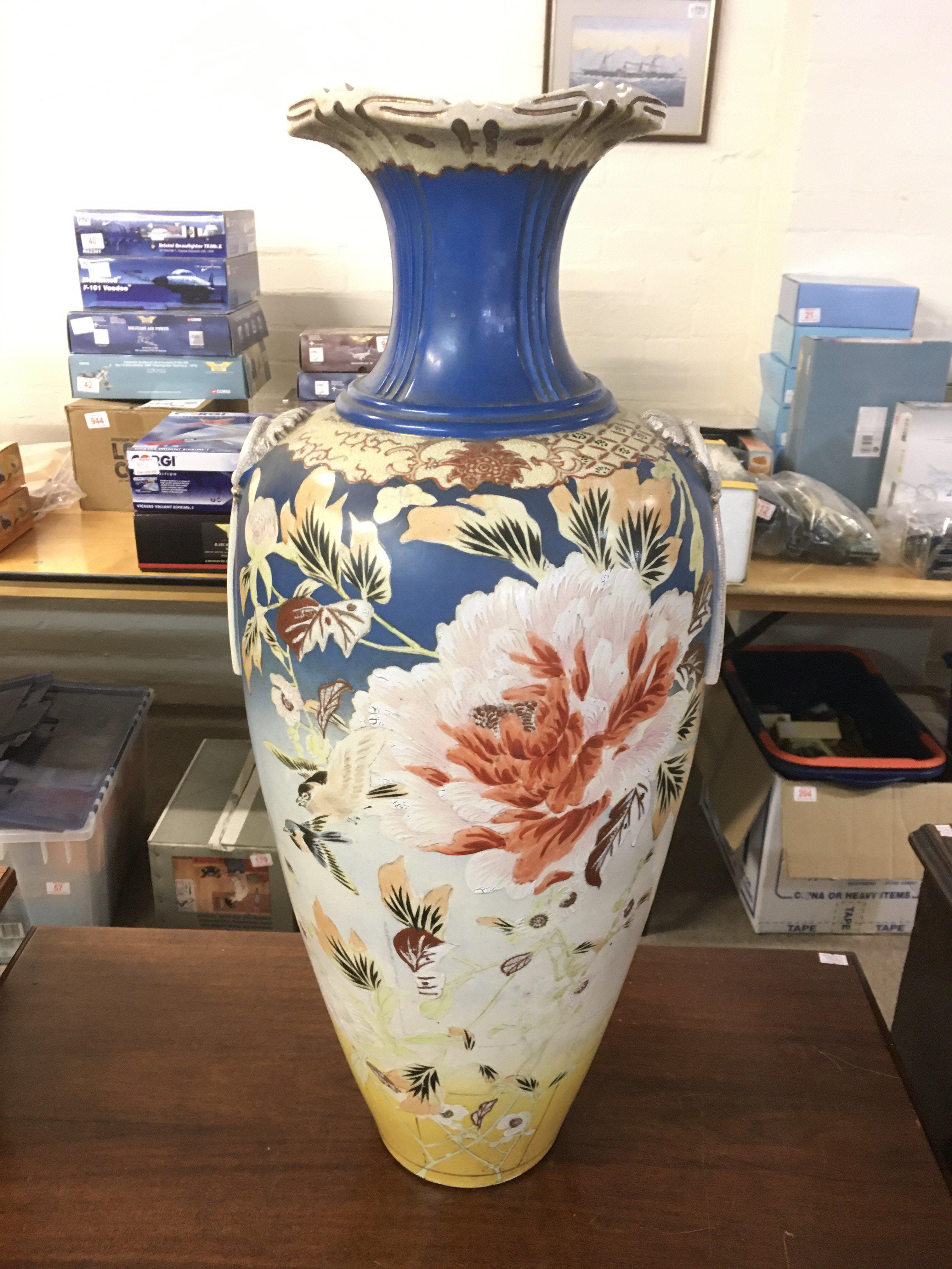 A large Satsuma vase decorated with birds and foli