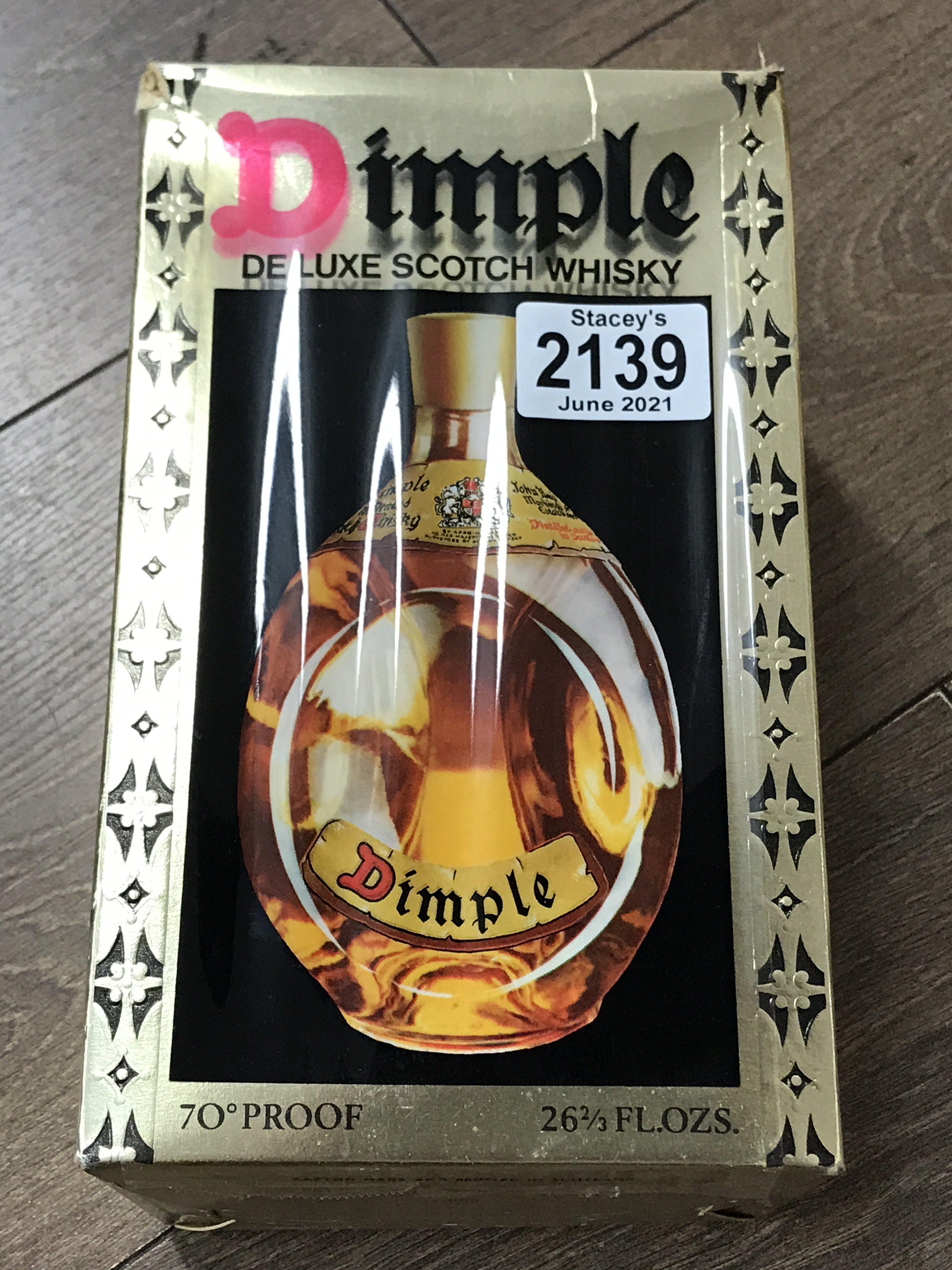 A boxed bottle of Dimple DeLuxe Scotch Whisky