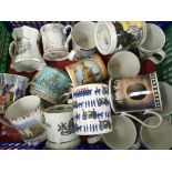 Two boxes containing various commemorative mugs an