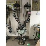 Two standard lamps in the Moorish style together w