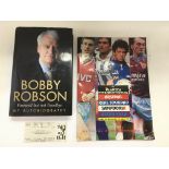 A signed Bobby Robson autobiography together with a 1990 Makita International football program and a