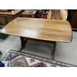 A Ercol dining table, 152cm x 84cm
