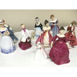 A collection of Royal Doulton figures including Am