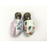 Two miniature porcelain perfume bottles.