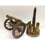 A wooden model of a cannon and a trench art desk stand (2).