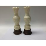 A pair of early 20th century carved Indian ivory v