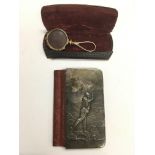 An old silver cased golf wallet, similar to one on display in St Andrews golf museum, together