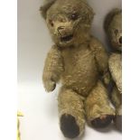 Two vintage teddy bears in worn condition, as well