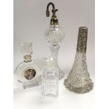 Four glass perfume bottles, one with a silver coll