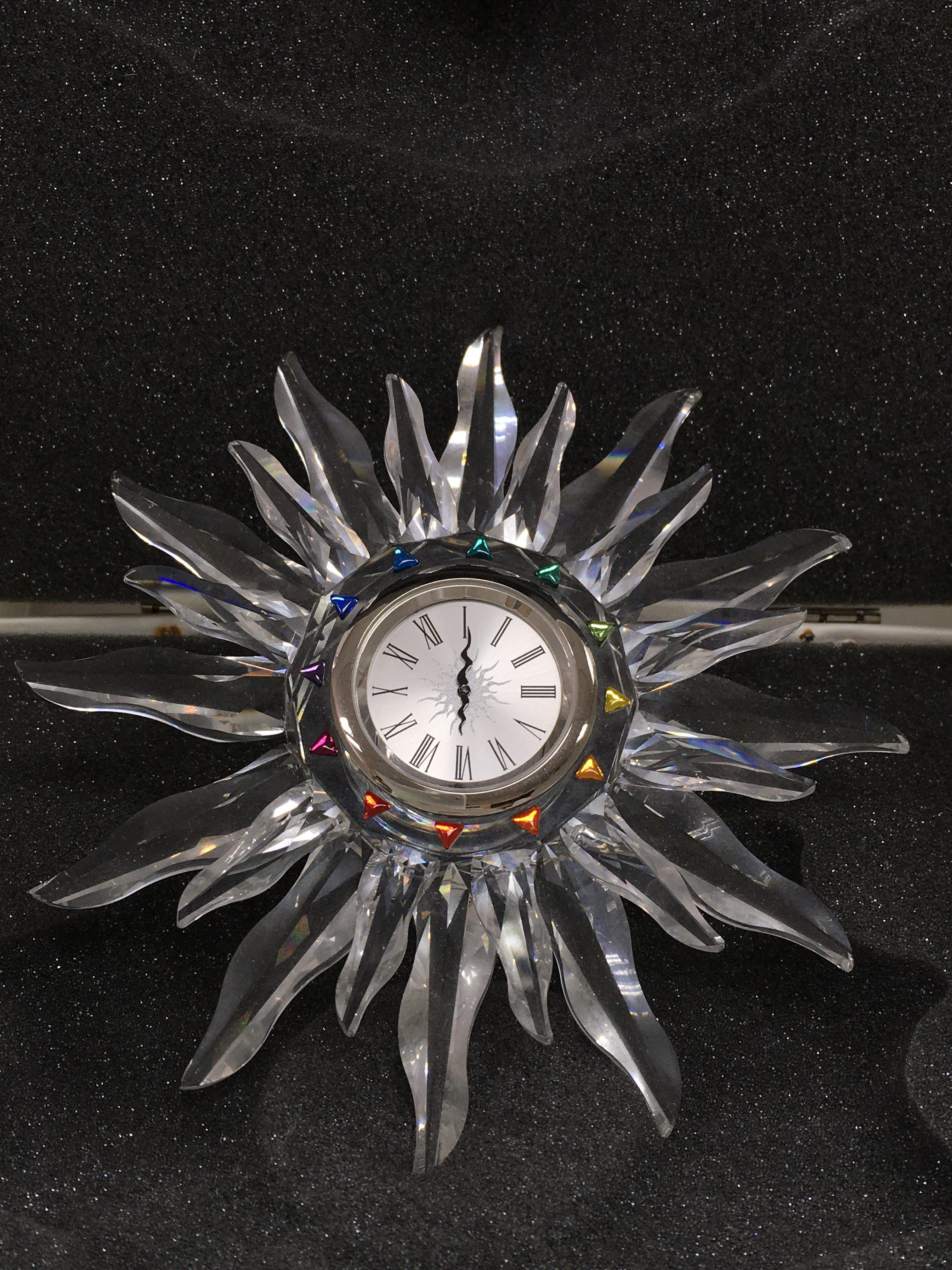 The Swarovski Crystal Starburst Clock complete wit