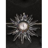 The Swarovski Crystal Starburst Clock complete wit