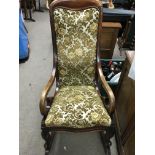 A Victorian Mahogany Rocking chair With upholstere