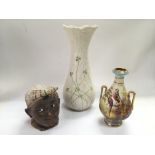 A Belleek vase, tobacco jar and a vase decorated with birds and foliage (3).