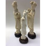 Three early 20th century carved ivory figures of G