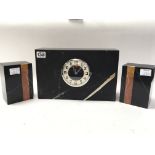 An art Deco marble clock flanked by marble garniture. No reserve