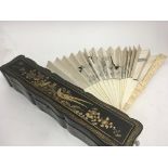 An Early 20th century carved ivory and silk fan th