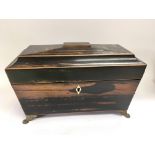 A Regency coromandel tea caddy with gilt metal fit