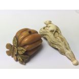 Two late 19th century Japanese Netsuke one stained