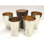 A leather cased set of stirrup cups.