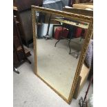 A gilt framed mirror of rectangular shape - NO RES