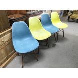 A set of four vintage designer chairs in coloured