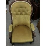 A Queen Anne style arm chair on wheels. The height