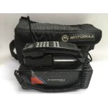 A vintage Motorola 4800X mobile phone, charger and carry case.