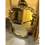 A continental style gilt wood wall mirror with scroll decoration and three other frame (4)