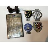 A collection of vintage car badges a Rhodesia AA badge B-S Brooklands badge and a Lymington 1910