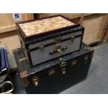 A large Vintage traveling trunk an aluminium trunk and a tray set with numerous wine bottle