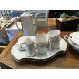 A German white glazed porcelain coffee set with a matching tureen.