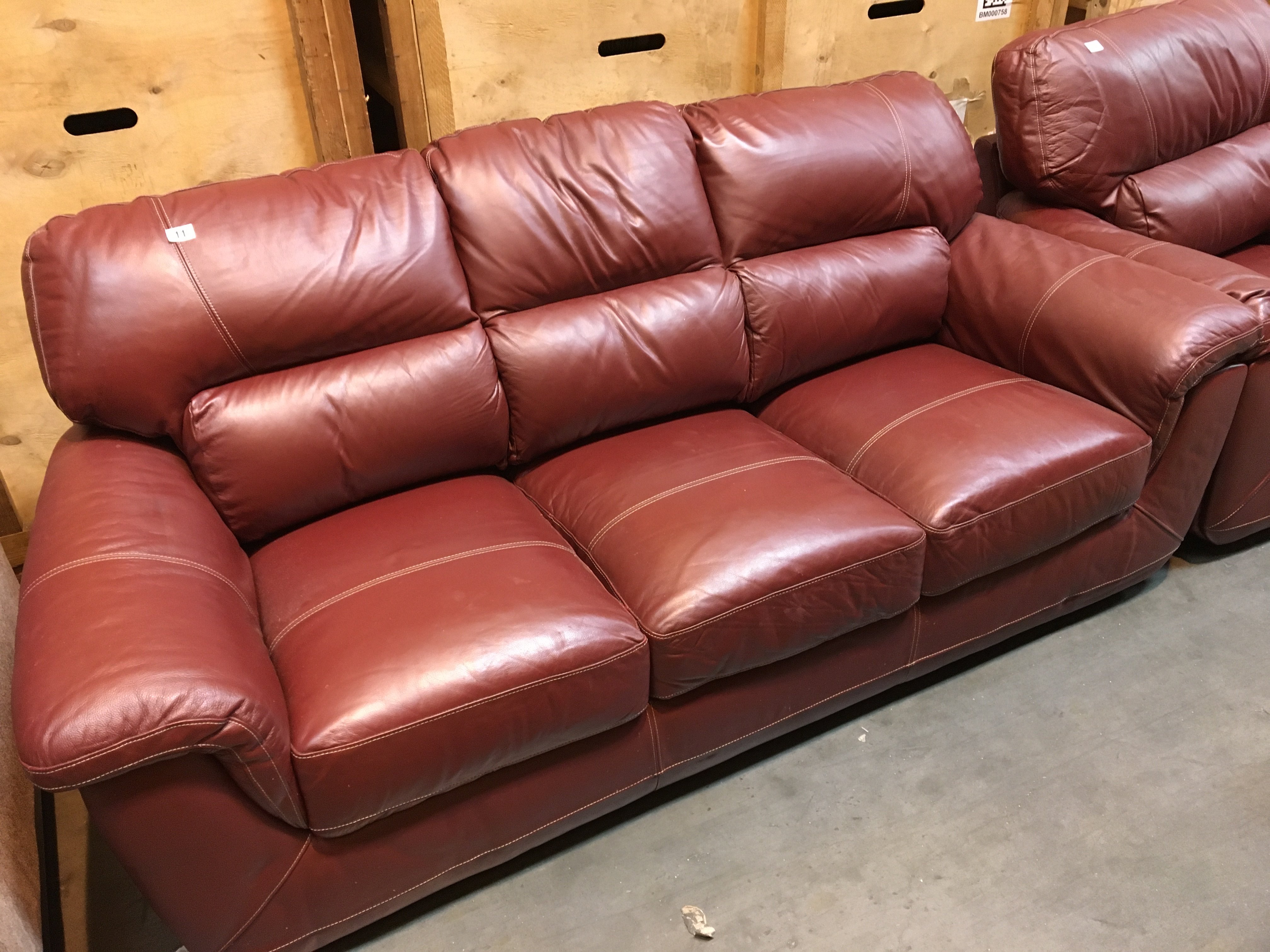 A good quality red leather three seater sofa and matching arm chair (2)