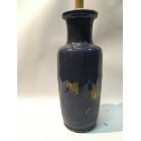 A 19th century Chinese export porcelain vase decorated with applied gilt on a blue ground the top