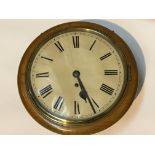 A single fusse light oak cased wall clock. With pendulum no key Diameter of case 33cm.