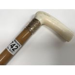 A Victorian walking stick with Ivory handle and a