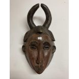 An African tribal mask with horns.