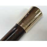 A Briggs of London walking cane with 9ct gold top