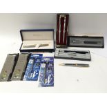 A collection of pens including Parker and Waterman