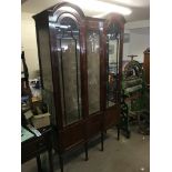 An Edwardian inlaid mahogany three door cabinet wi