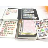 A collection of four stamp albums containing world