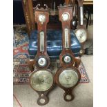 Two inlaid mahogany wall barometers.